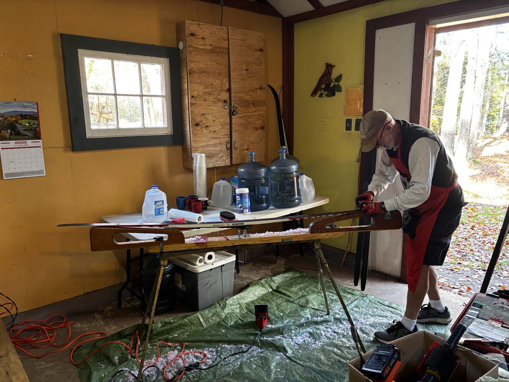 A man scraps a ski